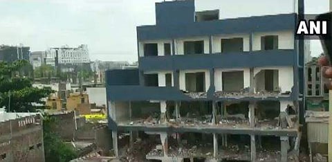 The illegal multi-storied building in Kamdhenu Nagar. (Photo | ANI)
