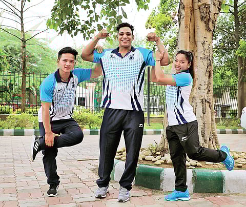 (from left) Weightlifters Jeremy Lalrinnunga, Ajay Singh and Mirabai Chanu at Sports Authority of India centre in New Delhi on Tuesday | Fatima Rezavi