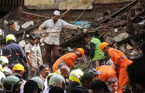 Rescuers conduct search operation at the site of the collapsed four-storey Kesarbai building at Dongri in Mumbai Wednesday July 17 2019. | PTI