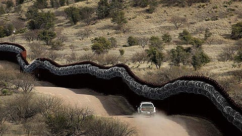 A Customs and Border Control agent patrols on the US side of Mexico-Arizona border (File Photo| AP)