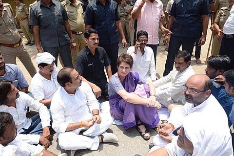 AICC General Secretary Priyanka Gandhi Vadra stopped illegally near Narayanpur Police Station in Mirzapur. She sits on protest at road in Mirzapur after being stopped from proceeding to Sonbhadra. (Photo | Special arrangement)