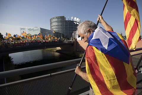 A demonstrator holds a flag of the Spanish Catalan region outside the European Parliament in Strasbourg, eastern France, Tuesday June 2, 2019. (Photo | AP)