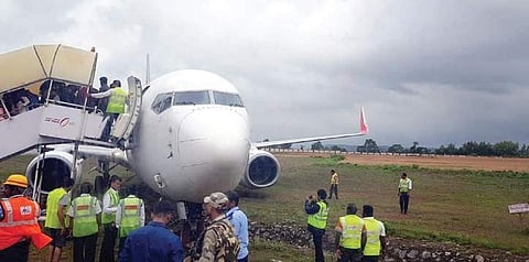 Passengers being evacuated from AI Express flight at Mangalore International Airport. (Photo | EPS)