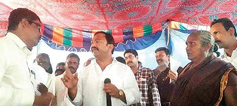 YSRC MLA Namburu Sankara Rao directing revenue officials to return `50,000 bribe to a complainant at Spandana in Guntur district on Monday | Express