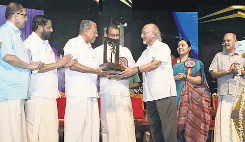T J S George, senior journalist and Editorial Advisor, The New Indian Express, receiving Swadeshabhimani-Kesari Award from Chief Minister Pinarayi Vijayan at the Tagore Theatre in Thiruvananthapuram on Monday. Poet Prabha Varma, Devaswom Minister Kadakamp