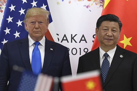 President Donald Trump, left, poses for a photo with Chinese President Xi Jinping during a meeting on the sidelines of the G-20 summit in Osaka, Japan, Saturday, June 29, 2019. ( Photo | AP)
