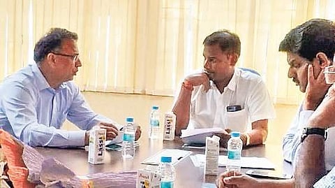 Sports and Youth Services Minister Tusharkanti Behera (centre) interacting with department officials in Bhubaneswar. (Photo | Irfana, EPS)
