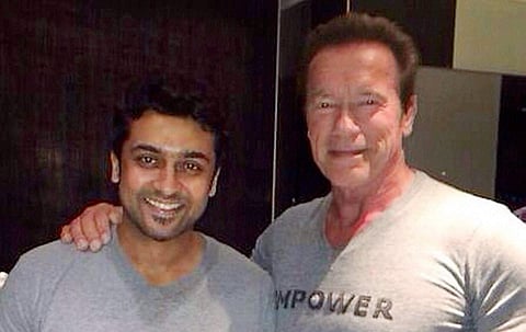 Hollywood star Arnold Schwarzenegger with actor Suriya at a gym in Chennai. (File Photo | PTI)