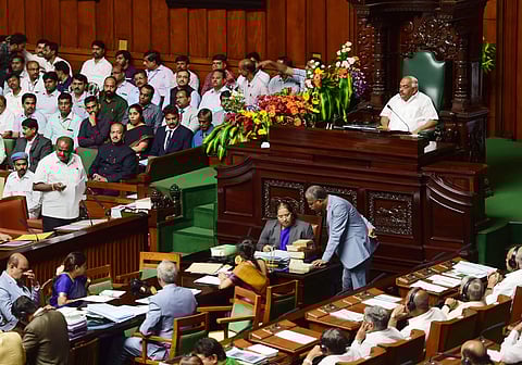 Karnataka Chief Minister HD Kumaraswamy speaks during the Assembly Session at Vidhana Soudha in Bengaluru Friday July 19 2019. Karnataka Assembly speaker KR Ramesh Kumar is also seen. (Photo | PTI)
