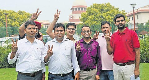 Amrapali homebuyers flash the victory sign at the SC in New Delhi | Arun Kumar