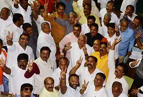 BJP state president B S Yeddyurappa celebrates after winning the vote of confidence  at Vidhana Soudha in Bengaluru on Tuesday. (Photo | Vinod Kumar T, EPS)