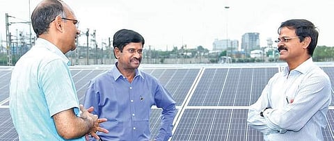 Chief Electrical Inspector for Hyderabad DVS Raju inspecting solar installations at HMR Uppal depot in Hyderabad on Tuesday (Photo | EPS)