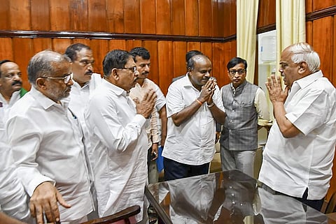 Karnataka Chief Minister HD Kumaraswamy and his deputy G Parameshwara meet Karnataka Assembly Speaker KR Ramesh Kumar after losing the vote of confidence in Assembly Session at Vidhana Soudha in Bengaluru Tuesday July 23 2019. | PTI