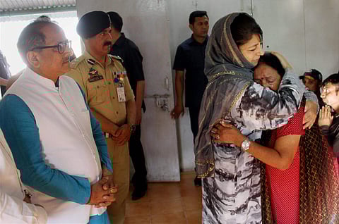 The then Jammu and Kashmir Chief Minister Mehbooba Mufti consoling an Amarnath pilgrim who survived the Anantnag militant attack. M Nirmal Kumar was also seen. (File Photo |PTI)