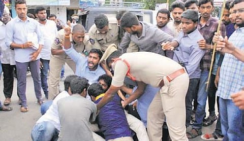 Telugu Nadu Students Federation (TNSF) workers being arrested by the police for burning the effigy of CM Jagan Mohan Reddy in Guntur on Tuesday | Express