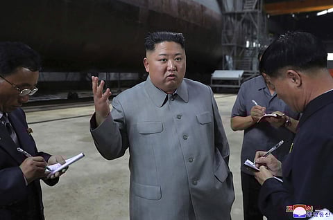 North Korean leader Kim Jong Un, center, speaks while inspecting a newly built Sub Marine. (File Photo |AP)