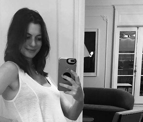 Anne Hathaway flaunts her baby bump. (Photo | Instagram)