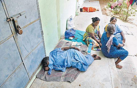 With no proper facilities, workers rest in spaces available around the temple premises | R Satish babu