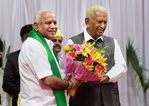 Karnataka Governor Vajubhai Vala greets newly sworn in Karnataka Chief Minister B S Yeddyurappa at Raj Bhavan in Bengaluru Friday July 26 2019. | PTI
