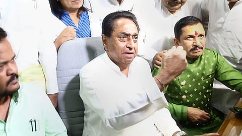 Madhya Pradesh Chief Minister Kamal Nath along with two BJP MLAs Narayan Tripathi and Sharad Kaul speaks to media person in the State Assembly during the monsoon session in Bhopal Wednesday July 24 2019. | PTI