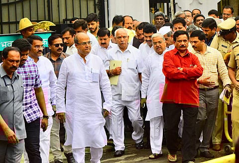 Karnataka BJP chief Yeddyurappa coming out of Raj Bhavan after meeting the Governor. (Photo | Pandarinath B, EPS)