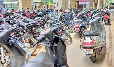 People continue to park on footpaths because of space constraints near the Metro station | Express