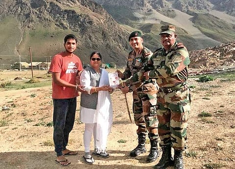 Nibedita and son Soumyaranjan being presented a memento by officers of 12th Mahar at Drass in Kargil | ( Photo | Express )