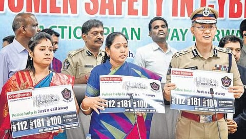 Home Minister Mekathoti Sucharitha and DGP Gautam Sawang releasing the poster of toll free numbers of helplines set up under Cyber Mithra at Velagapudi on Friday,July 26 (Photo | EPS)