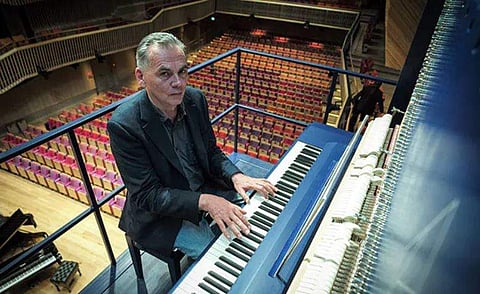 Attached high on the wall of a concert hall in Latvia, the steel-framed vertical grand piano hangs as if in mid-air some three storeys above the audience. (Photo | AFP)