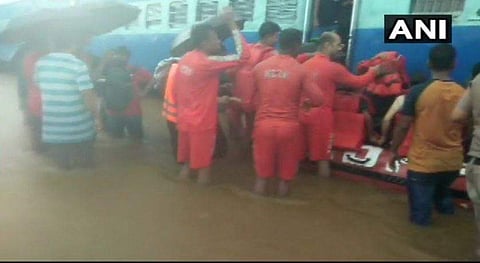Rescue officials enter the stalled Mahalaxmi Express (Photo | ANI)
