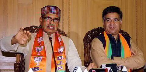 BJP National Membership In-charge Shivraj Singh Chouhan with party's J&K President Ravindar Raina addresses a press conference in Srinagar Saturday July 27 2019. | PTI