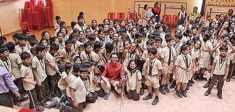 Ambi poses with the kids