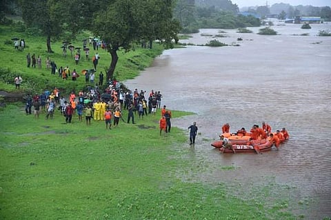700 people were stranded on board Mumbai-Kolhapur Mahalaxmi Express about 60 km out of Mumbai on 27 July 2019 after heavy rains paralysed the city and its surrounding areas. (Photo | ANI)