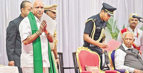 Newly sworn-in Chief Minister B S Yediyurappa greets the gathering after the oath-taking ceremony at Raj Bhavan on Friday | Vinod Kumar T