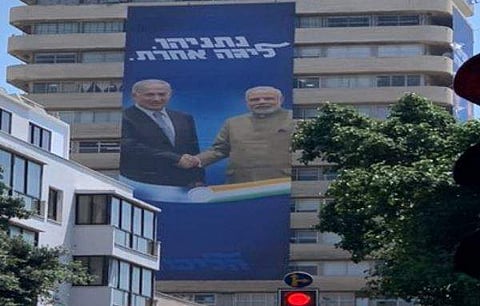 An election advertisement banner, featuring the image of Prime Minister Narendra Modi standing with his Israeli counterpart Benjamin Netanyahu. | ( Photo | Israeli journalist Amichai Stein Twitter )