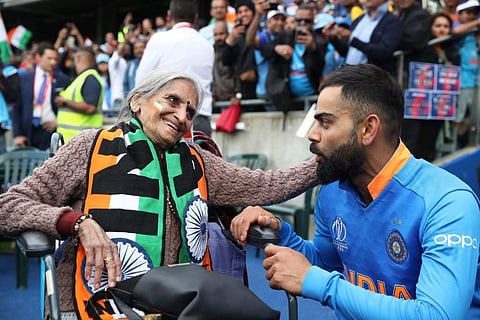 Charulatha Patel, 87, attracted all the cameras as she enthusiastically blew her trumpet, cheering for Kohli and his men from the stands. (Photo | Twitter)