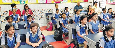 Deputy Chief Minister Manish Sisodia, Sonam Wangchuk (third from right, back row) and others in a government school on Monday | EXPRESS