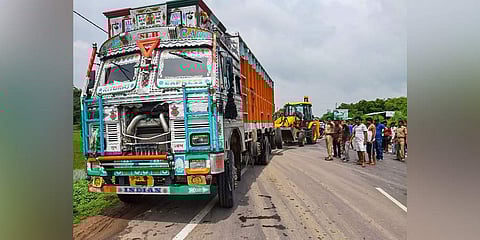 People stand near the site of accident in which the Unnao rape survivor was seroiusly injured after the car in which she was travelling collided with a truck, near Raebareli, Sunday, July 28, 2019.(Photo | PTI)
