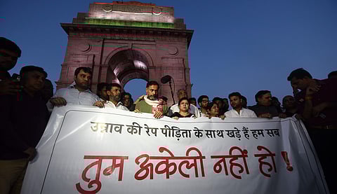 People assemble to send across a message of solidarity to the Unnao rape Victim at India Gate in New Delhi. (Photo | Parveen Negi, EPS)