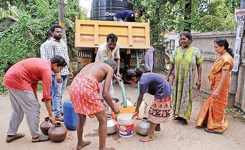 Residents of Thevarkkad collecting water from tanker lorries. The area has been facing acute water shortage for some months  A Sanesh