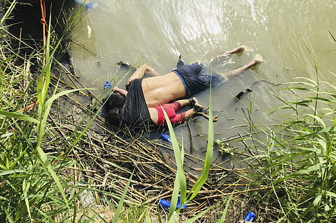 Bodies of Salvadoran migrant Oscar Alberto Martínez Ramírez and his nearly 2-year-old daughter Valeria lying on the banks of the Rio Grande in Matamoros, Mexico, after they drowned trying to cross the river to Texas (File photo| AP)