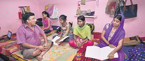 Dashraj Gyawali (left) at his house that has been converted into a hostel for blind girl students. Seen here are students studying in Braille and indulging in recreational activities
