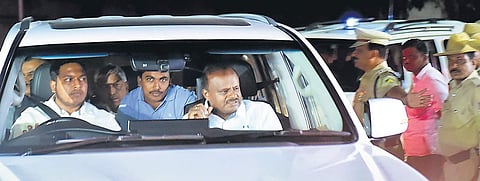 Chief Minister H D Kumaraswamy heads straight for the JDSLP meeting upon his arrival from the USA on Sunday. | (Shriram BN | EPS)