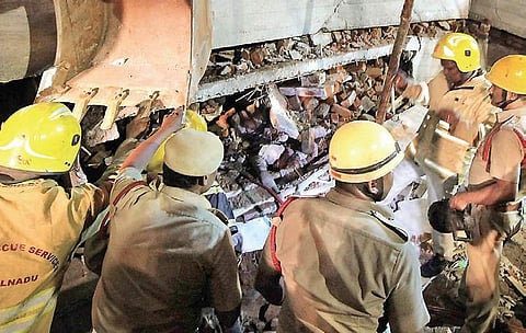 Fire and Rescue Services personnel at the scene of building collapse which resulted in the death of three persons at Madurai on Friday night | Express