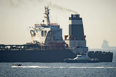 Royal Marine patrol vessel is seen beside the Grace 1 super tanker in the British territory of Gibraltar. (Photo | AP)