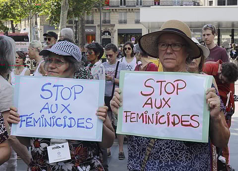 Women hold placards during a rally against women violence in Paris | AP