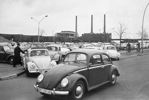 In this April 27, 1966 file photo, Volkswagen workers drive their Beetle cars from the parking lot on their way home at the end of a days work at the world's largest single auto plant, the Volkswagen factory (seen in background) in Wolfsburg, Germany. Volkswagen is halting production of the last version of its Beetle model in July 2019 at its plant in Puebla, Mexico, the end of the road for a vehicle that has symbolized many things over a history spanning eight decades since 1938.(File Photo | Associated Press)