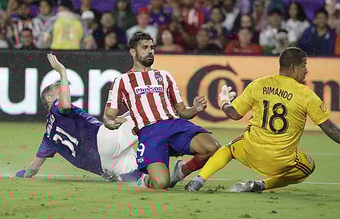 Costa made it three at the death from close range. | AP