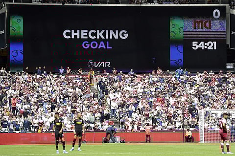 Players wait while a possible goal by Manchester City's Gabriel Jesus is checked by VAR during the English Premier League soccer match between West Ham United and Manchester City at London stadium in London. (Photo | AP)