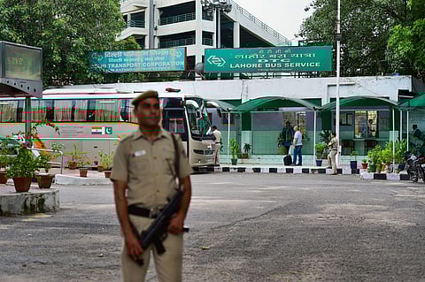 A security personnel stands guard as passengers board the Delhi-Lahore bus also known as Sada-e-Sarhad at Ambedkar terminal in New Delhi, Aug 9 2019. (Photo | PTI)